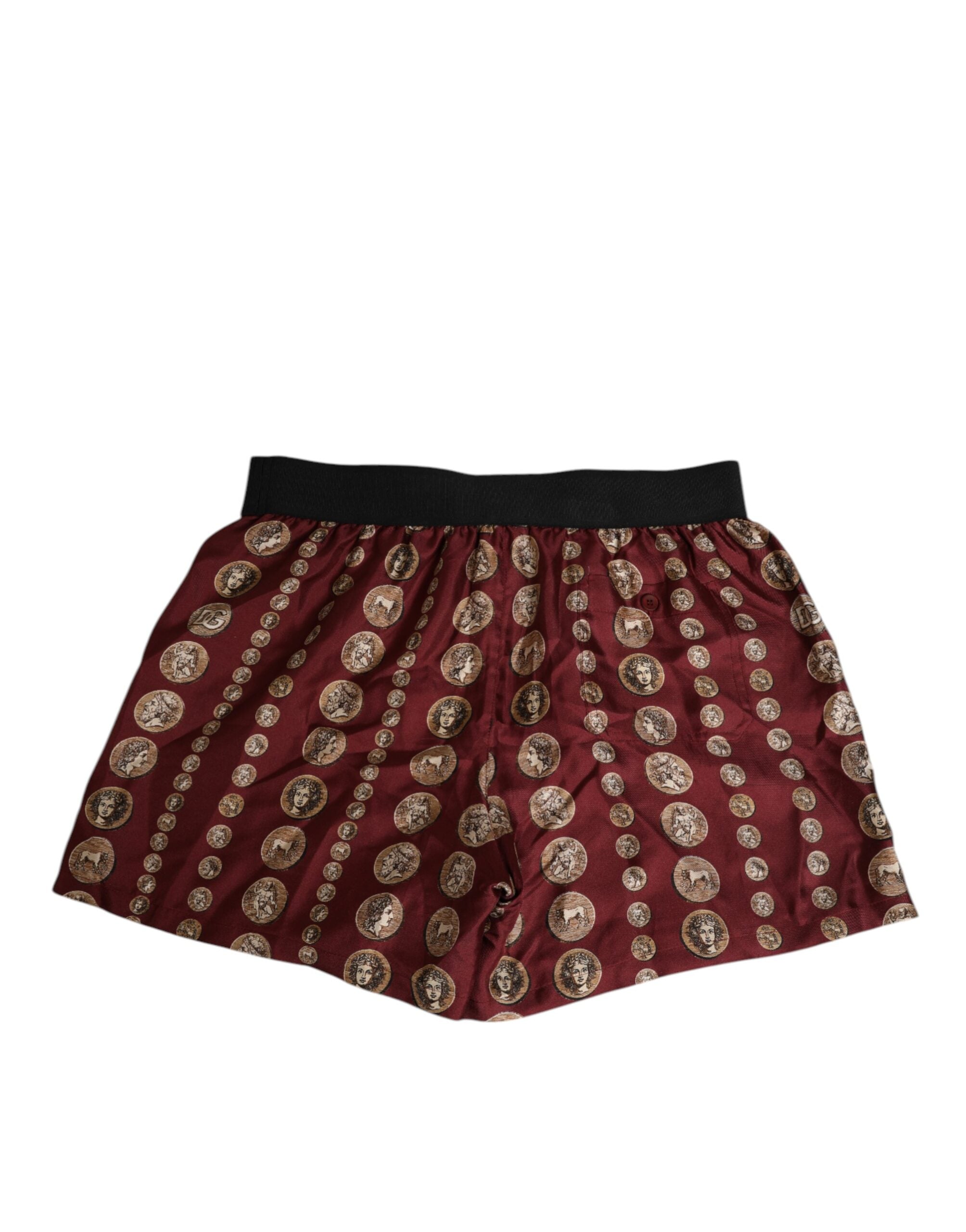 Boxers de bain pour homme Dolce & Gabbana en soie bordeaux avec imprimé pièces de monnaie, style élégant et confortable.