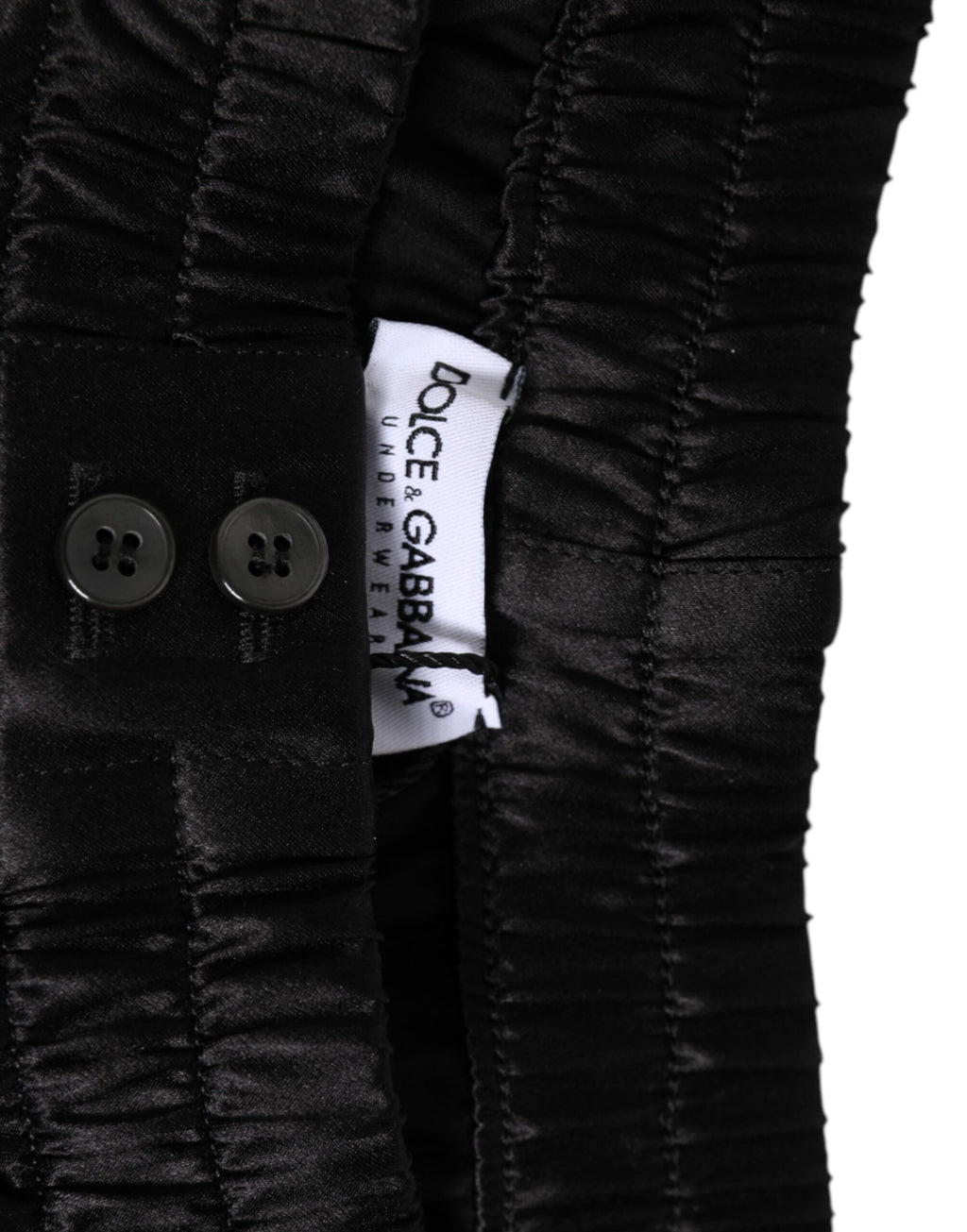 Boxers homme en satin de soie noir Dolce & Gabbana, short de bain élastique avec logo Dolce & Gabbana visible.