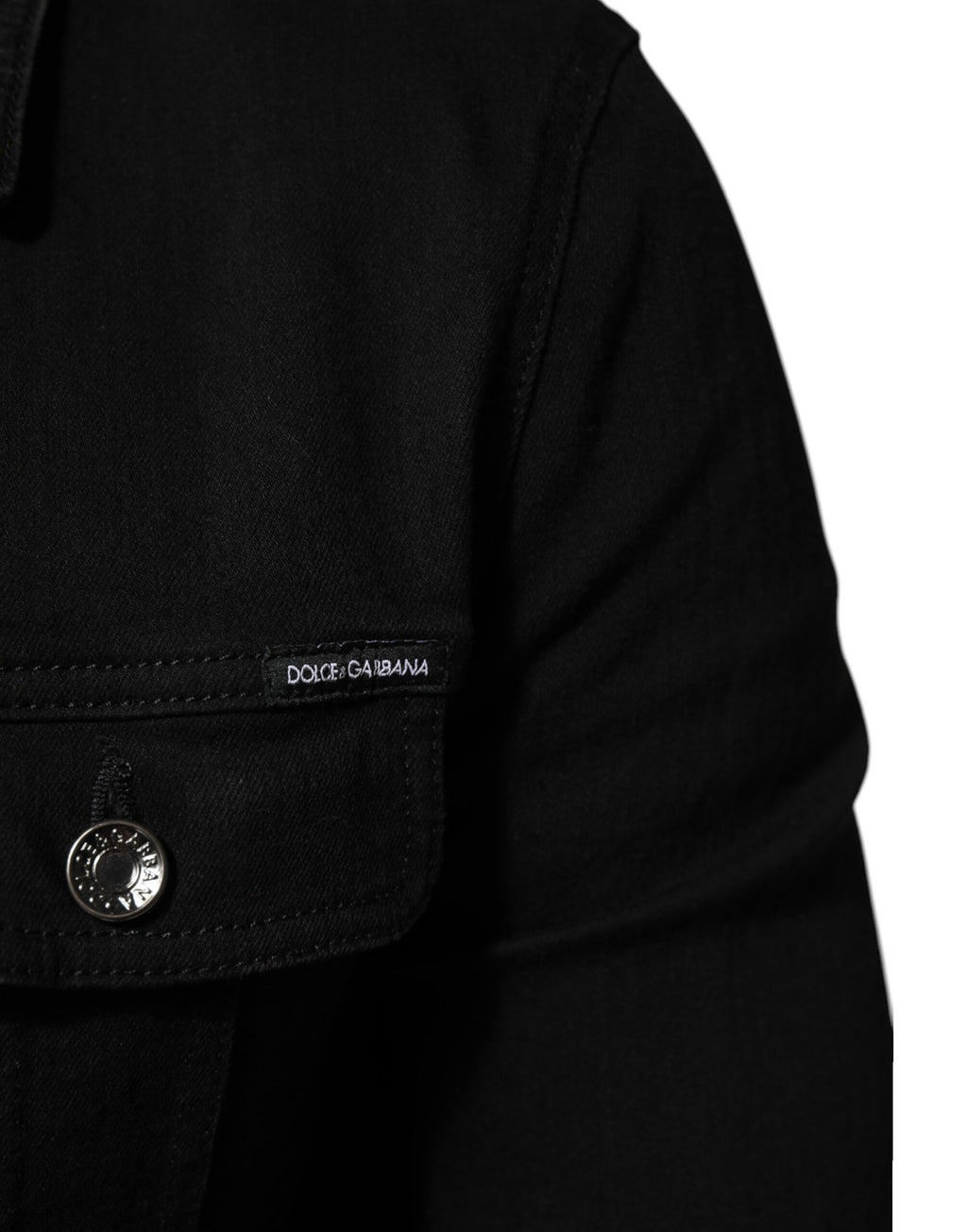 Veste en denim stretch noire Dolce & Gabbana en coton avec boutons, vue frontale sur un mannequin.