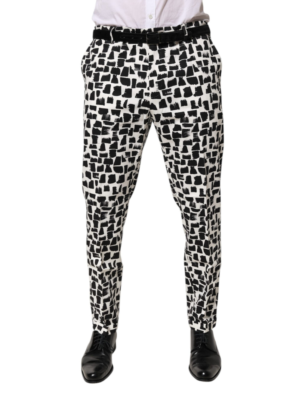 Pantalon en coton mélangé Dolce & Gabbana à motif abstrait noir et blanc, avec coupe élégante et design moderne.