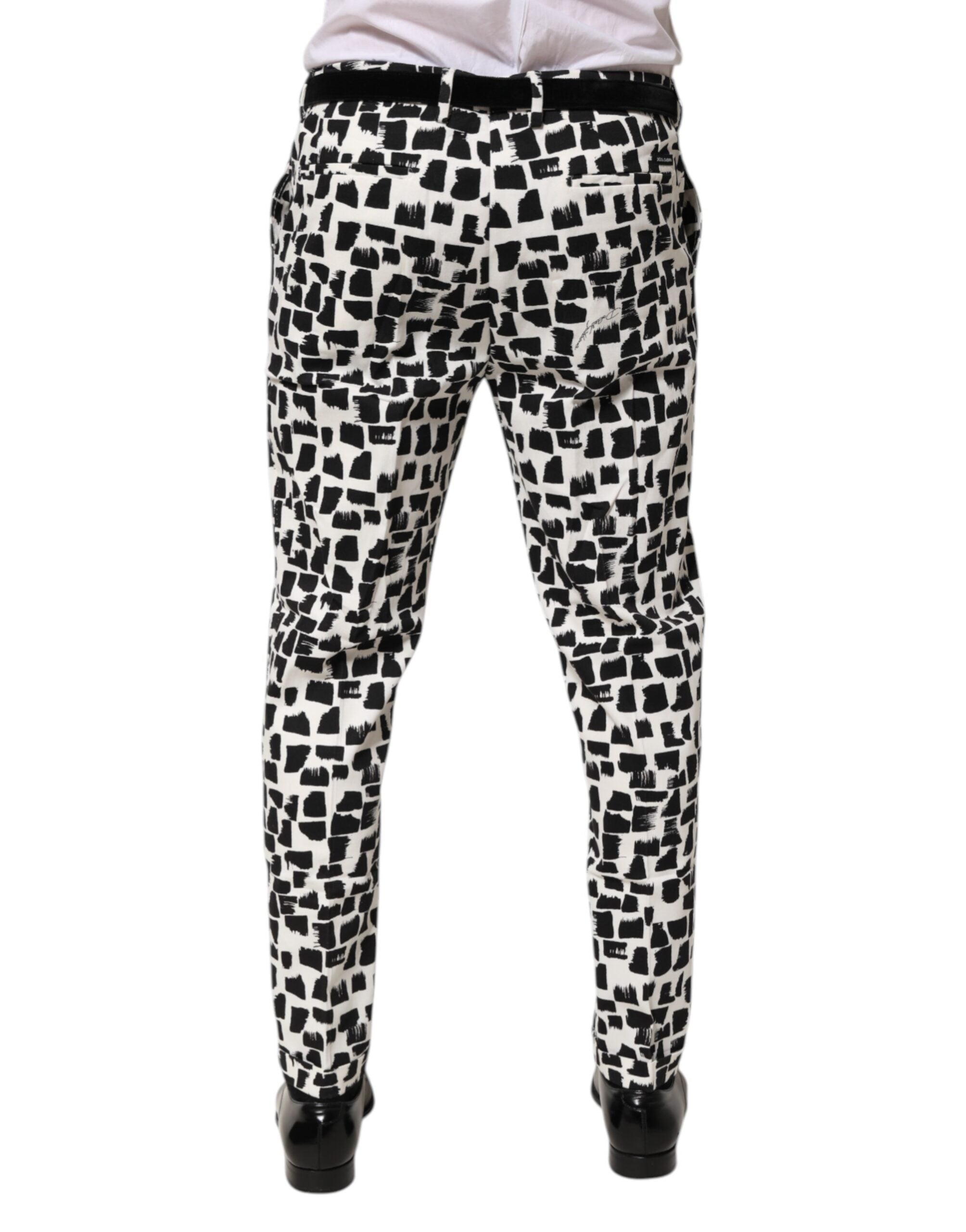 Pantalons Dolce & Gabbana en coton mélangé avec imprimé abstrait noir et blanc, style élégant et moderne.