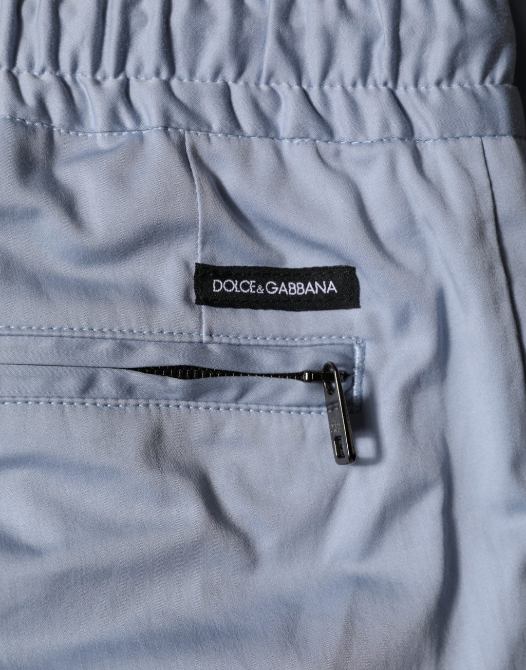 Pantalon homme Dolce & Gabbana Light Blue en coton avec taille élastique et cordon de serrage, couleur bleu clair.