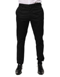 Pantalons homme Dolce & Gabbana en coton noir, coupe tapered, pantalons formels élégants, vue de face sur fond blanc