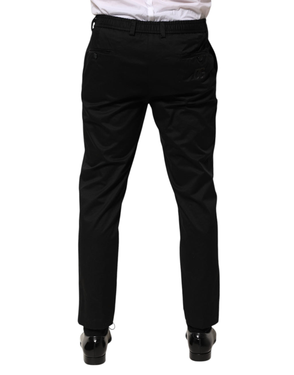 Pantalon homme Dolce & Gabbana en coton noir, coupe tapered, pantalon formel élégant avec poche arrière visible.