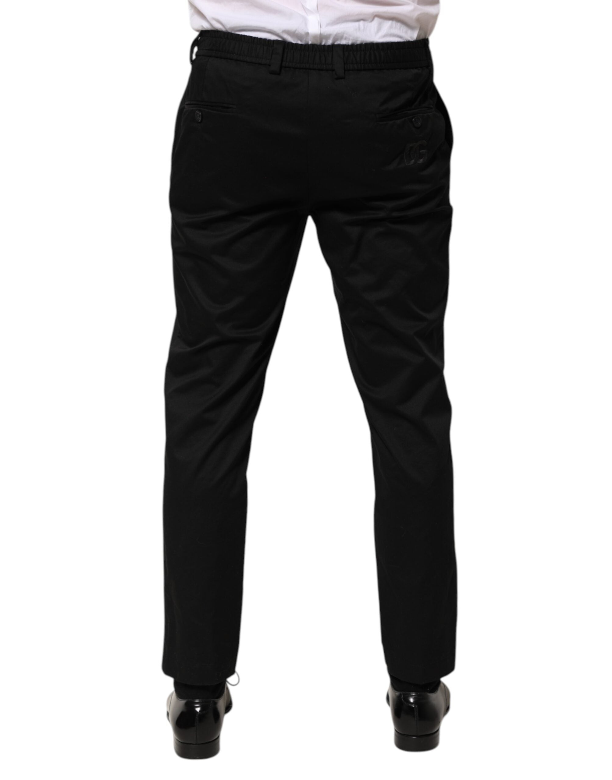 Pantalon homme Dolce & Gabbana en coton noir, coupe tapered, pantalon formel élégant avec poche arrière visible.