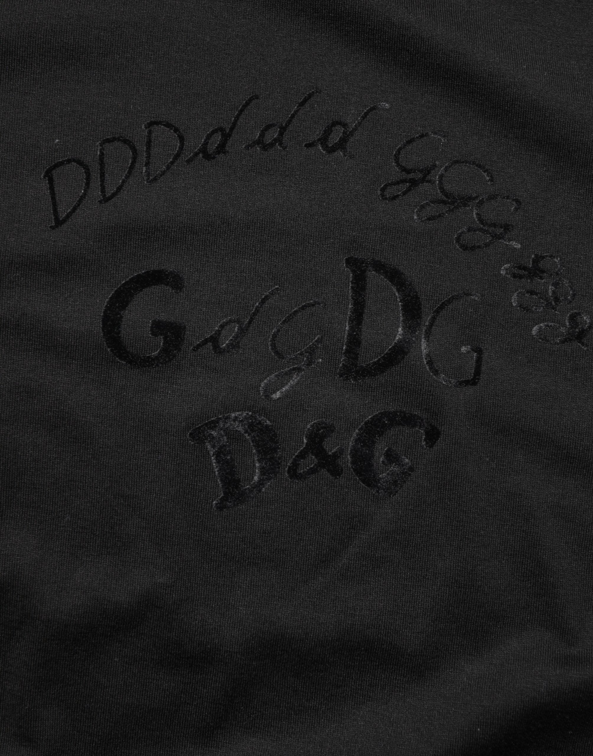 T-shirt noir en coton velours Dolce & Gabbana avec logo imprimé pour homme, vue de face.