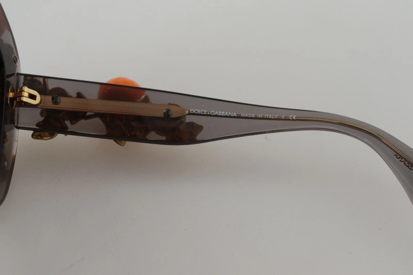 Lunettes de soleil Dolce & Gabbana DG4283B en acétate avec cristaux orange et appliques élégantes, vue de face.