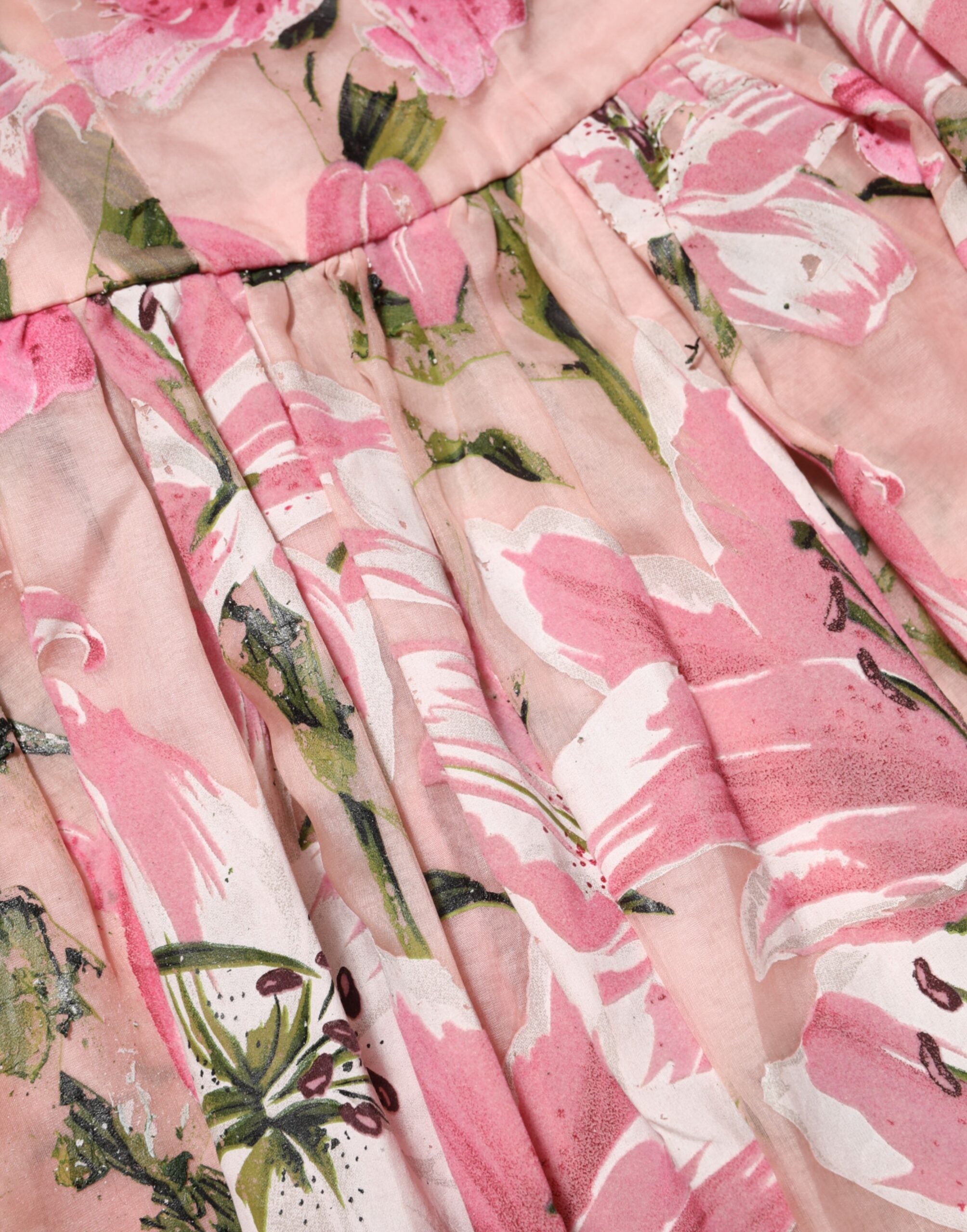 Robe sans manches en coton rose à fleurs plissée de Dolce & Gabbana, élégante et féminine.