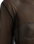 Blouse en mesh noir Dolce & Gabbana à col roulé transparent, élégante et ajustée, visible en détail dans l'image.