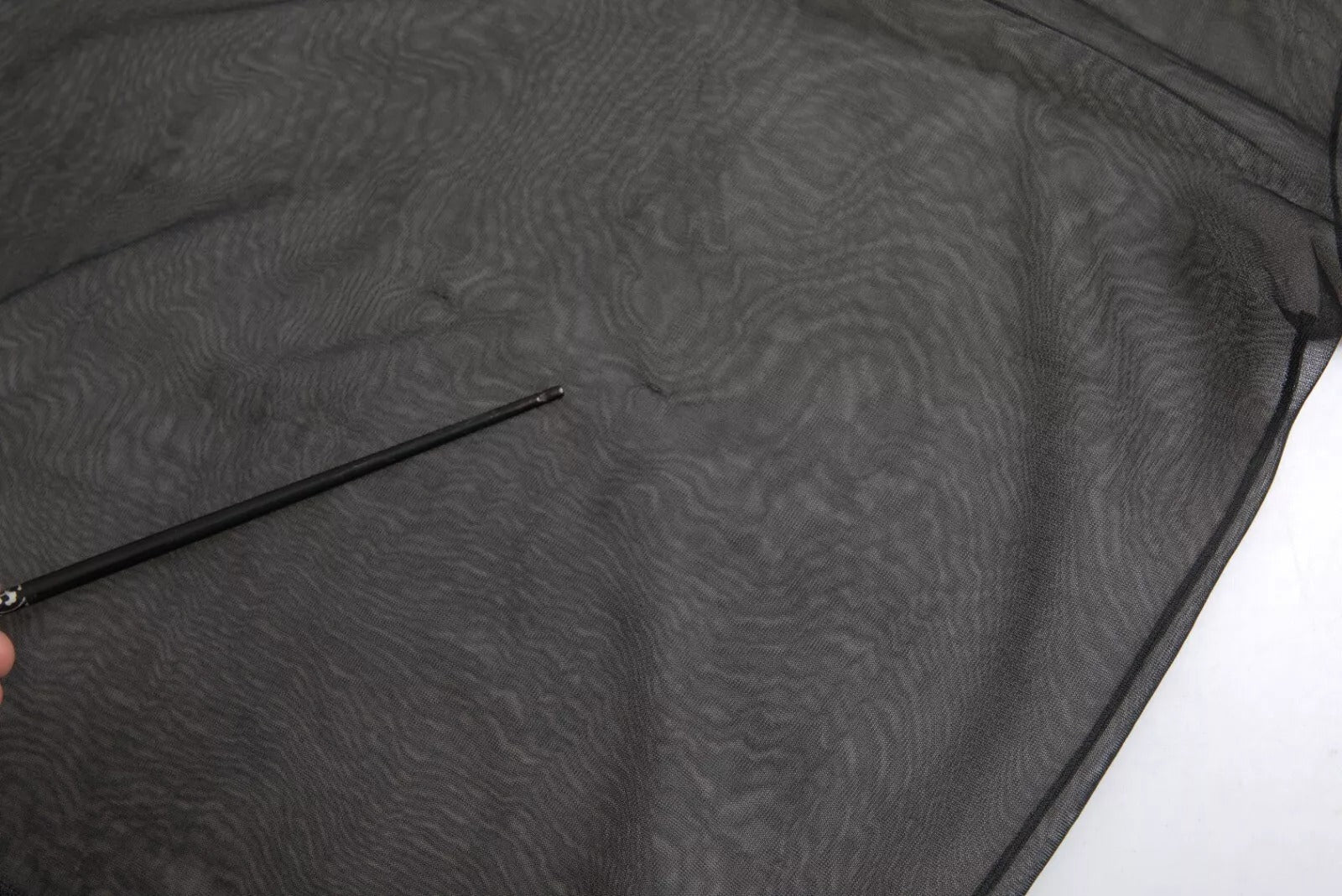 Blouse transparente en maille noire de Dolce & Gabbana avec col roulé et design moulant.
