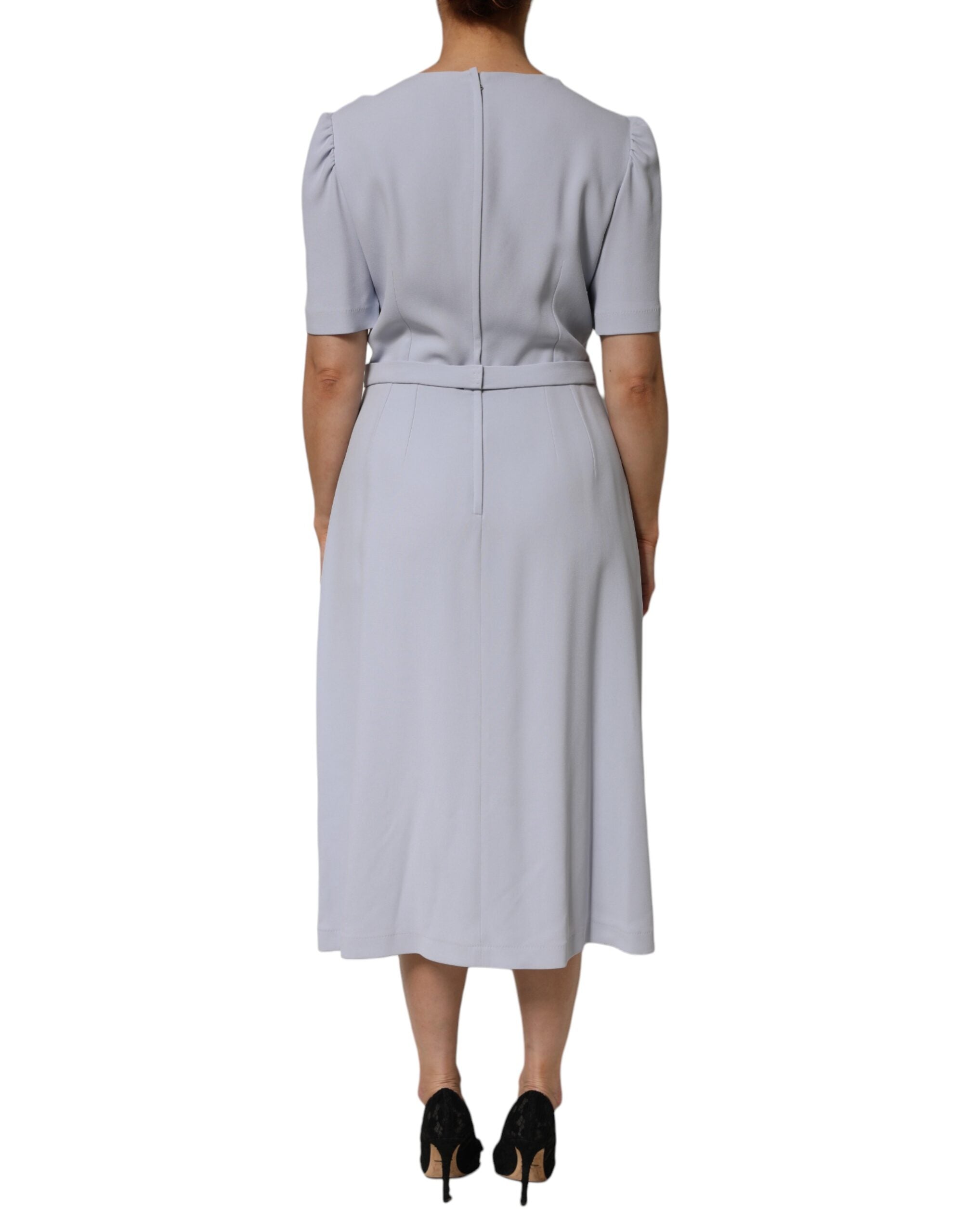Robe Dolce & Gabbana Light Blue en viscose avec appliqué floral, coupe élégante et détails raffinés visible sur l'image.