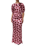 Robe de soirée maxi en satin de soie à pois roses et rouges de Dolce & Gabbana, vue de face avec détails élégants.