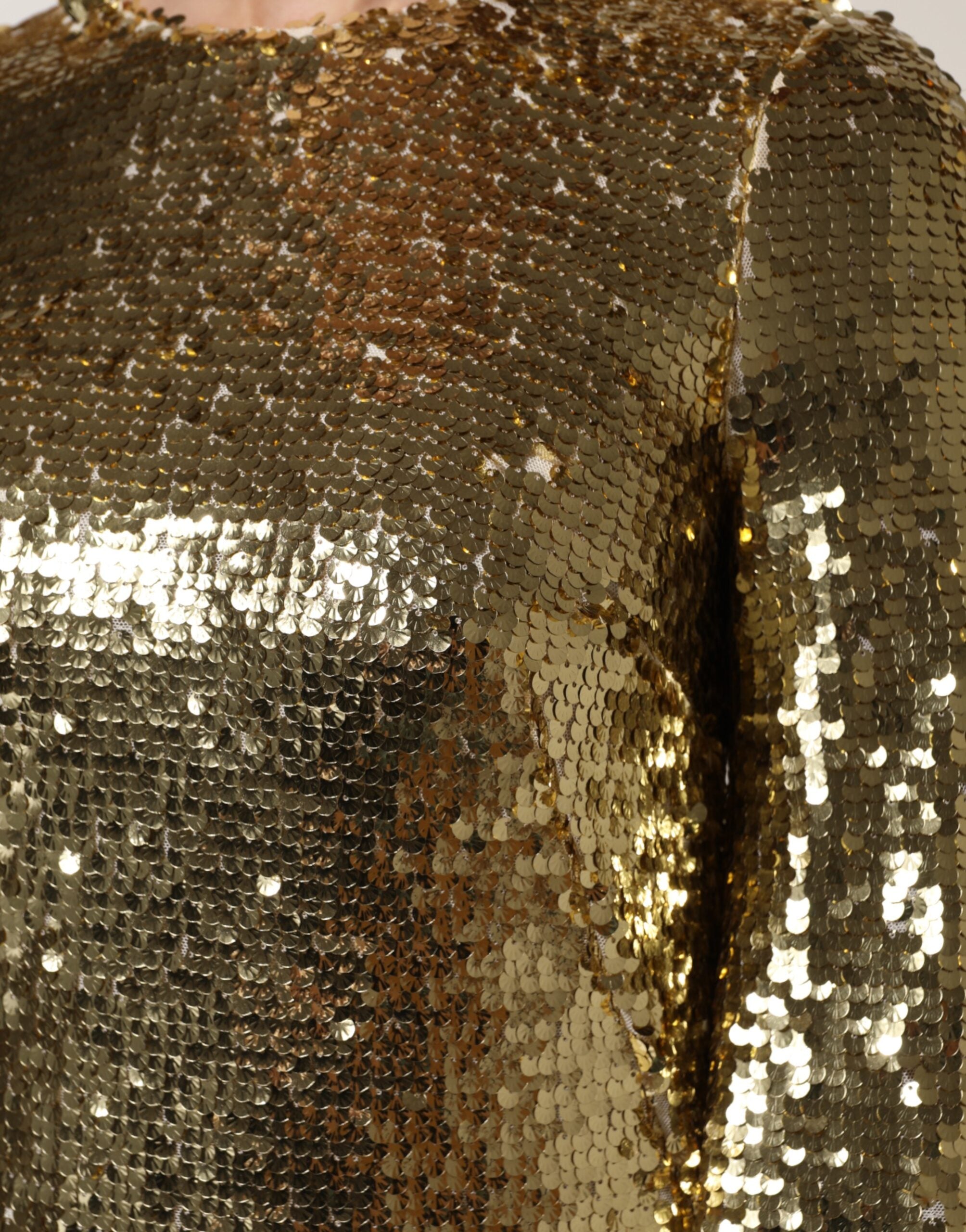 Robe courte dorée Dolce & Gabbana à sequins, manches longues et style élégant pour occasions spéciales.