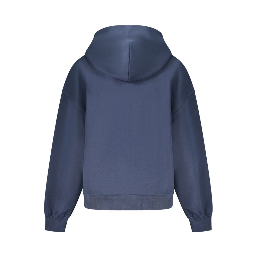 Sweat-shirt en coton bleu pour femmes de la marque Tommy Hilfiger, coupe décontractée et logo visible à l'avant.
