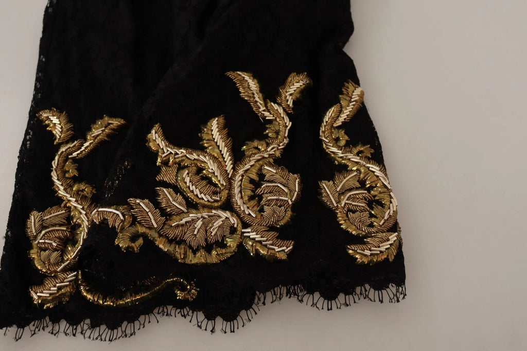 Shorts Dolce & Gabbana en dentelle noire et or, motif baroque, pièce spéciale, détails élégants visibles sur l'image.