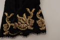 Shorts Dolce & Gabbana en dentelle noire et or, motif baroque, pièce spéciale, détails élégants visibles sur l'image.
