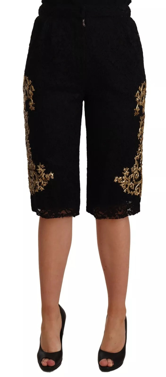 Shorts Dolce & Gabbana en dentelle noire et or baroque, pièce spéciale, détails élégants visibles sur l'image.