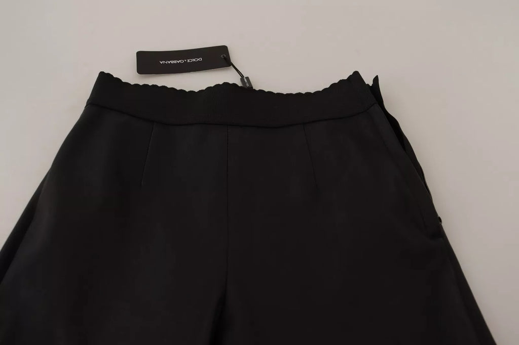 Pantalons noirs en cuir de Dolce & Gabbana avec ceinture élastique, style élégant et moderne pour femmes.