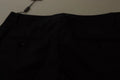 Pantalon noir à rayures Dolce & Gabbana, taille moyenne, coupe élégante, tissu en coton ou polyester, visible en détail.