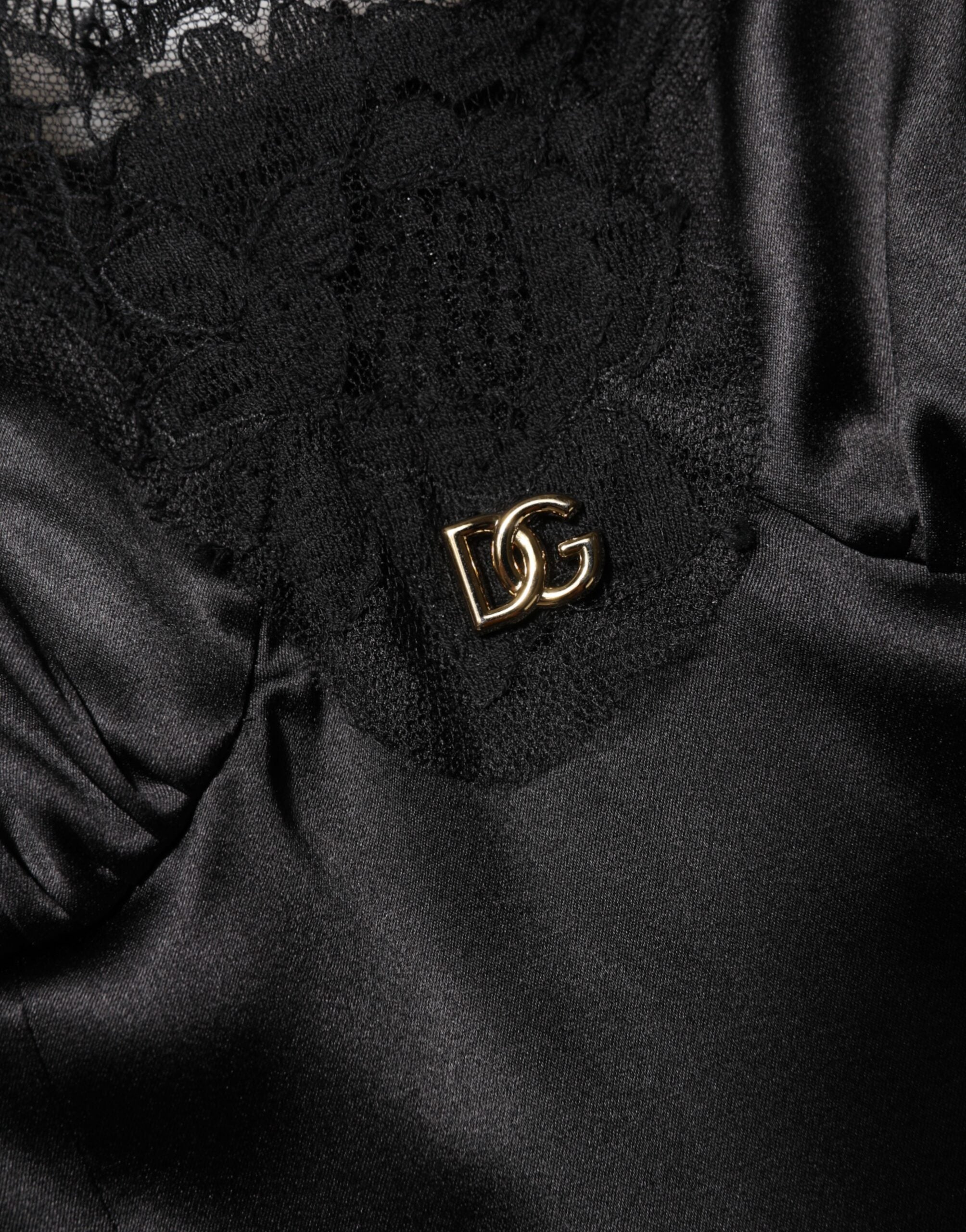 Robe courte sans manches Dolce & Gabbana en mélange de soie noire avec bordure en dentelle élégante.