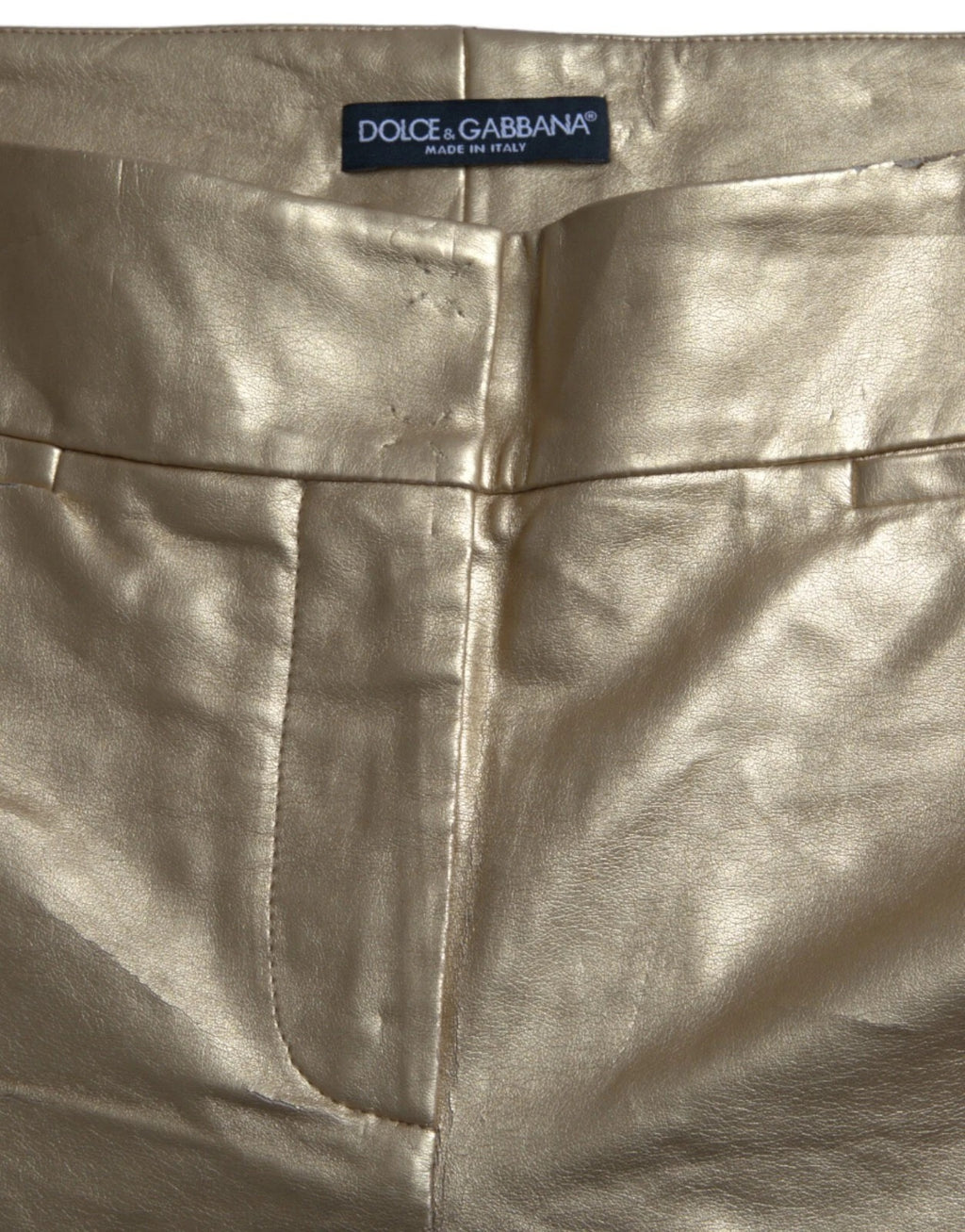 Pantalons métalliques dorés Dolce & Gabbana taille haute skinny pour femmes, en tissu brillant et ajusté.