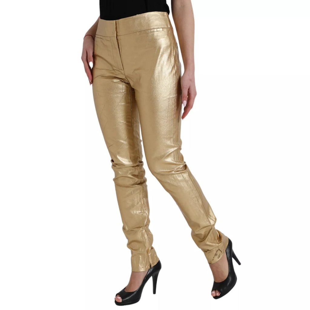 Pantalons métalliques dorés à taille haute pour femmes de Dolce & Gabbana, coupe skinny, tissu brillant et élégant.