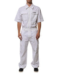 Pantalon jumpsuit utility blanc Dolce & Gabbana avec patch code-barres, fermeture éclair et poches, vue de face.