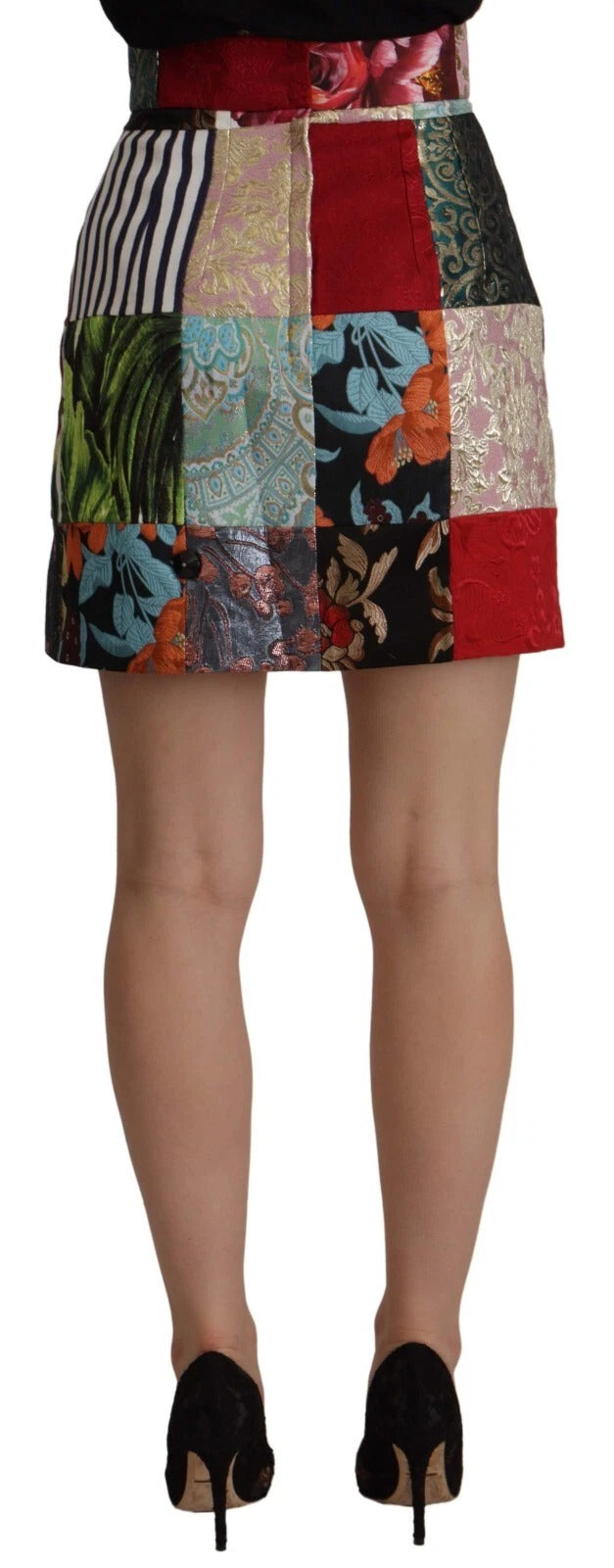 Jupe trapèze en polyester à patchwork multicolore de Dolce & Gabbana, vue de face avec motifs colorés et détails de couture.
