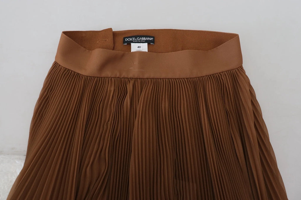 Jupe longue plissée en chiffon beige de Dolce & Gabbana, élégante et fluide, pour un style sophistiqué.