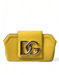 Sac clutch et bandoulière en cuir jaune lisse Dolce & Gabbana avec logo DG, élégant accessoire de mode.