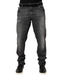 Jeans Dolce & Gabbana en denim noir et gris, coupe slim et jambe droite, visibles avec détails de lavage et couture.