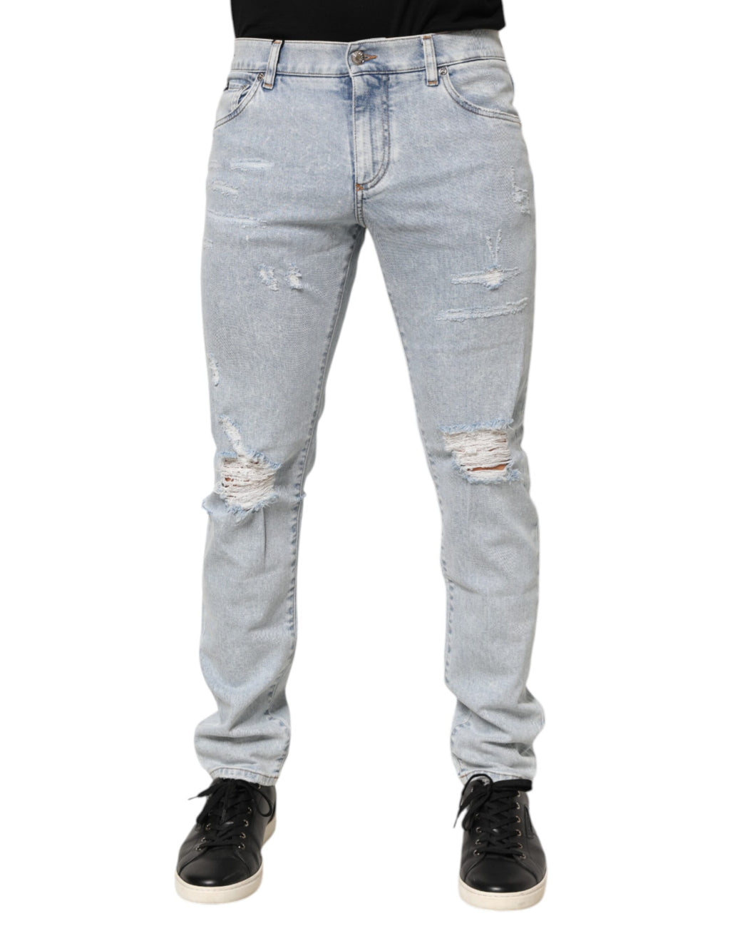 Jeans slim déchirés Dolce & Gabbana Light Blue en denim bleu clair avec détails usés et coupe ajustée.