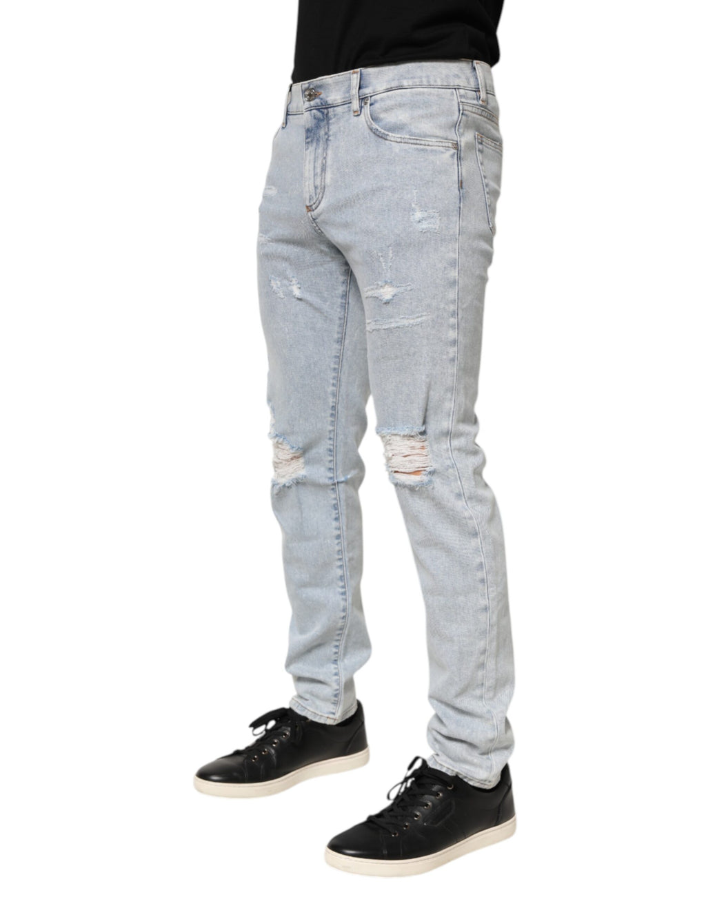 Jeans slim déchirés Dolce & Gabbana Light Blue en denim clair avec détails usés, style décontracté et moderne.