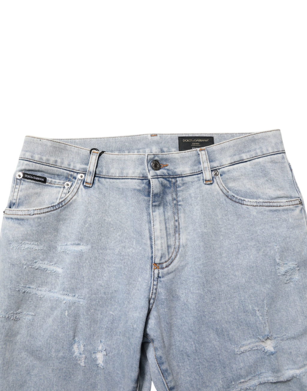 Jeans slim déchirés Dolce & Gabbana Light Blue en denim distressed avec coupe ajustée, visibles sur l'image.
