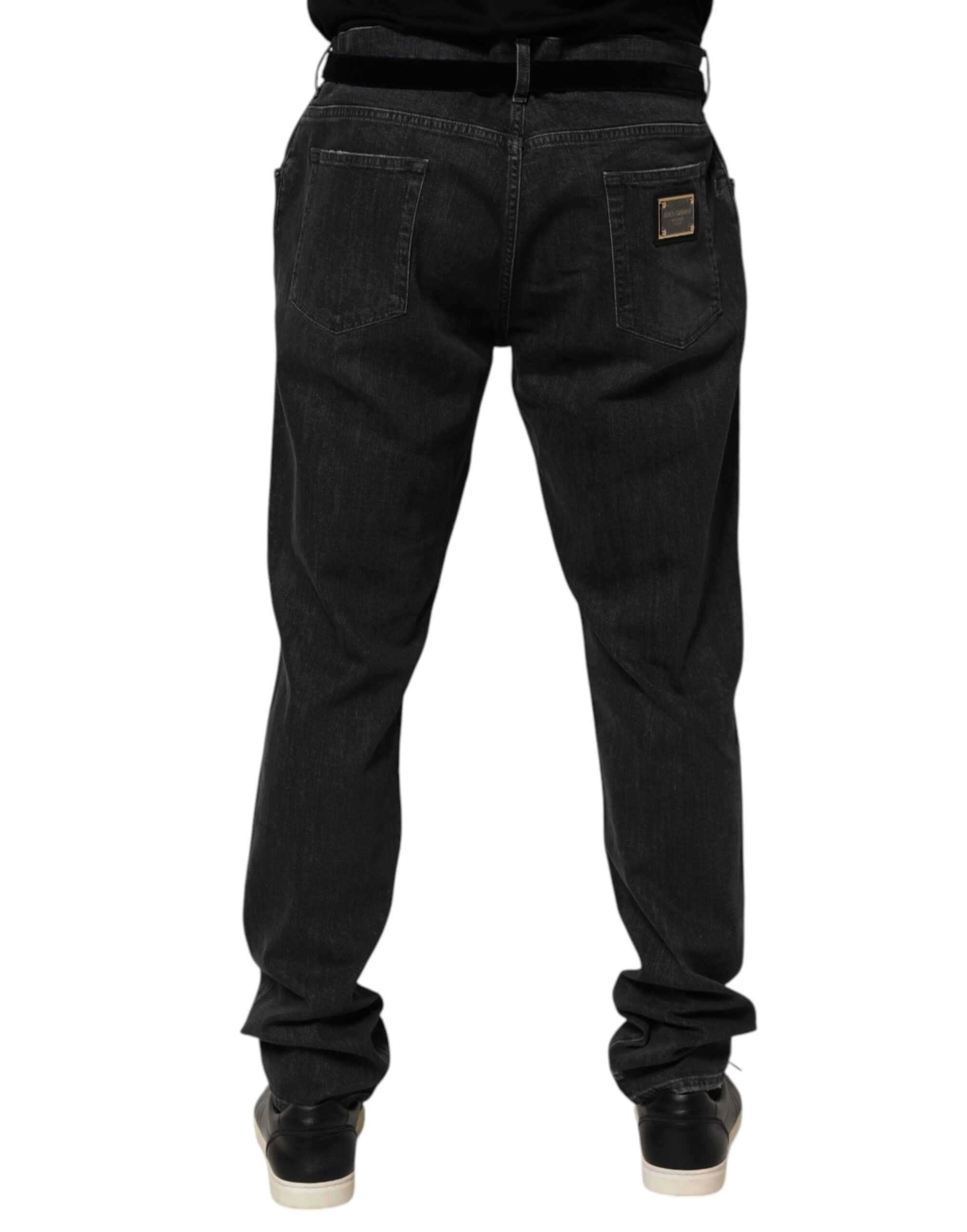 Jeans Dolce & Gabbana en coton noir, slim fit, déchirés et distressed, avec logo visible.