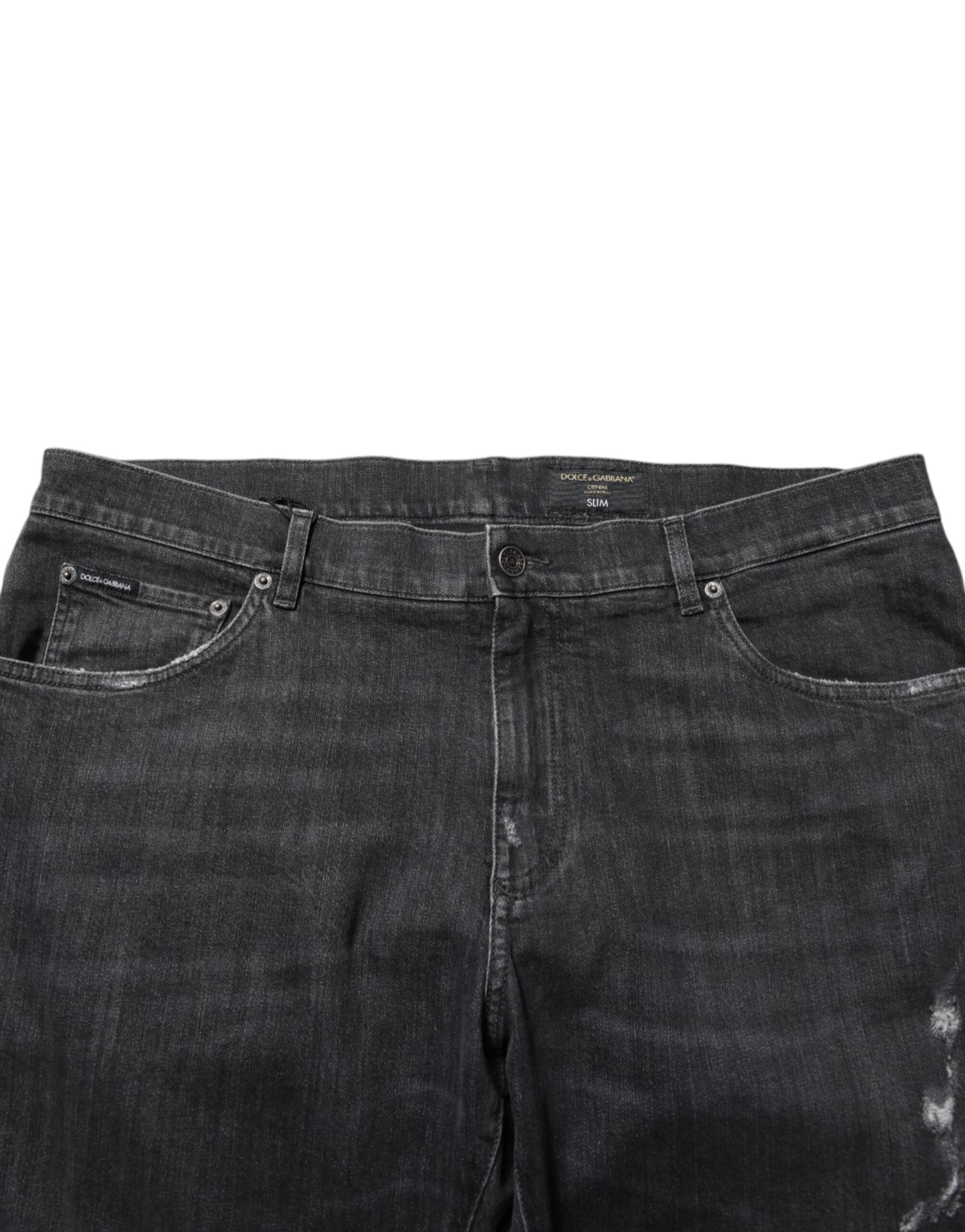 Jeans slim en coton noir Dolce & Gabbana avec déchirures, logo distressed, style décontracté et tendance.
