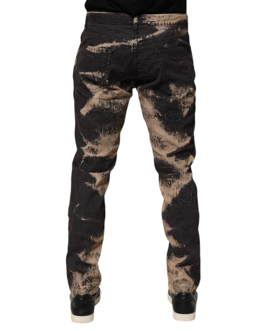 Pantalons en coton mélangé tie-dye beige et noir de Dolce & Gabbana avec corduroy, visible avec détails de texture et coupe décontractée.