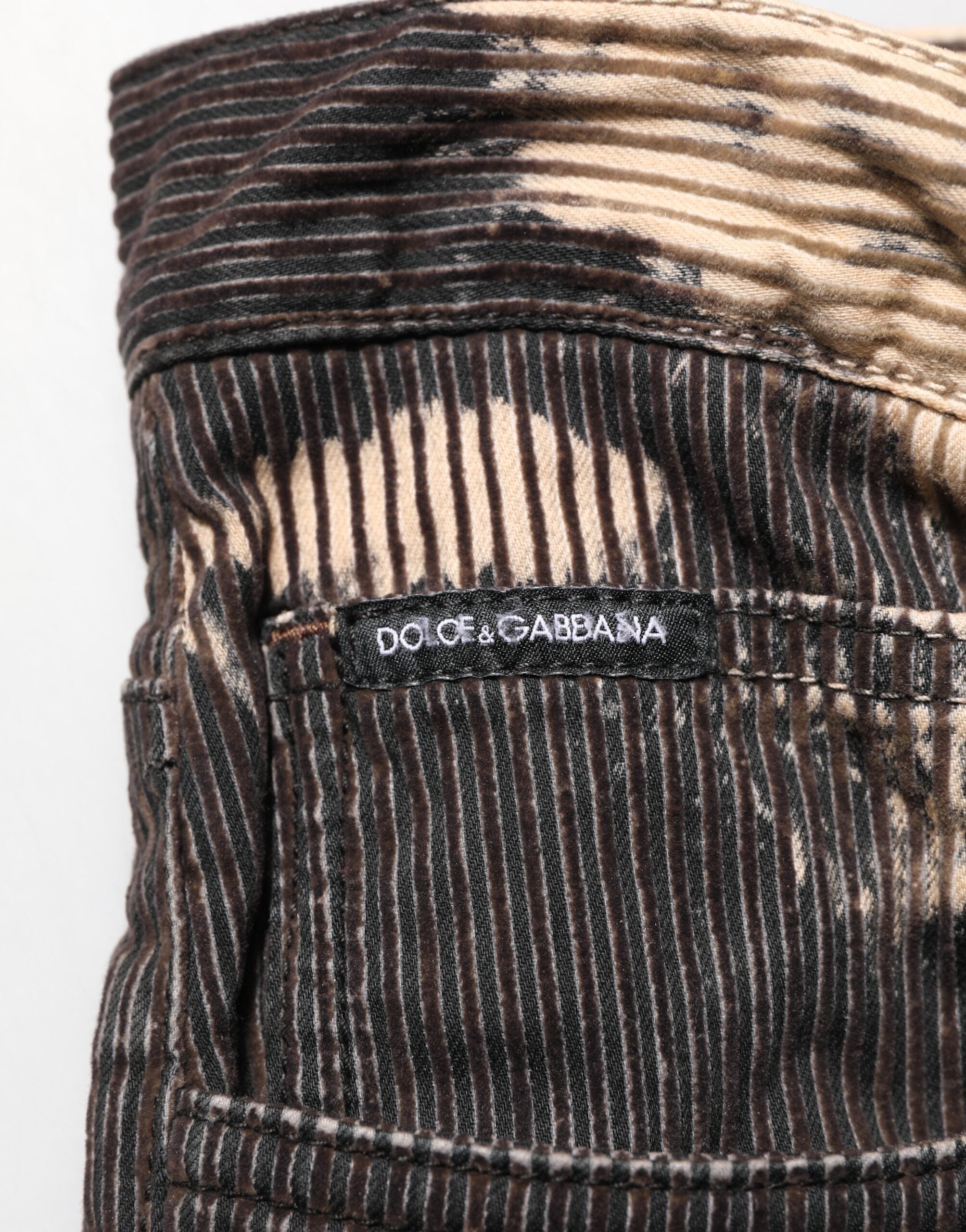 Pantalons Dolce & Gabbana en coton mélangé à rayures en velours côtelé beige et noir, style tie-dye, vue de face.
