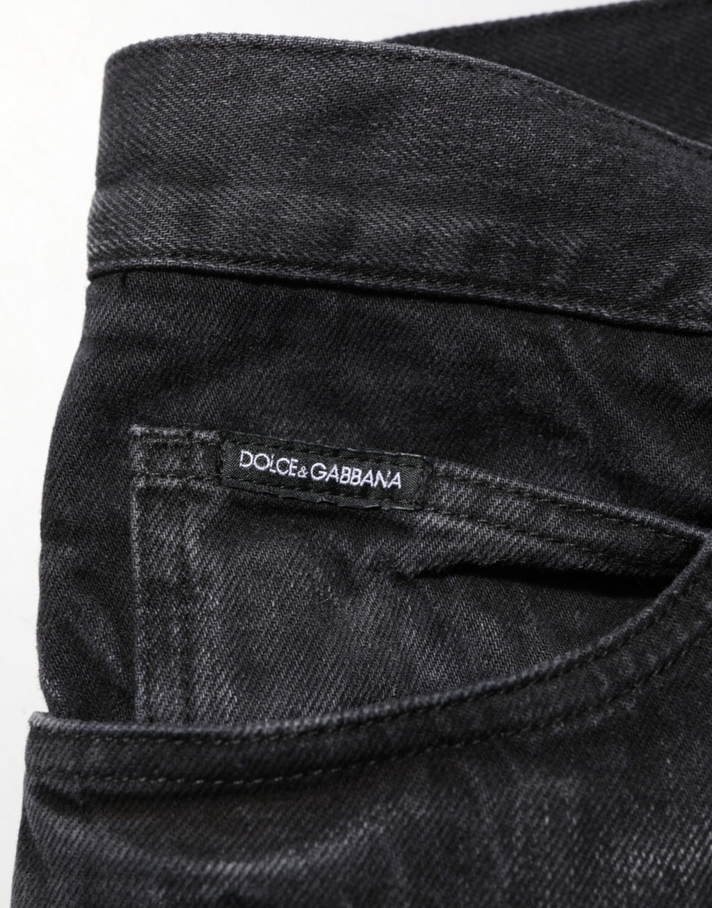 Jeans skinny en denim noir en coton délavé de Dolce & Gabbana pour homme, coupe ajustée et style moderne.