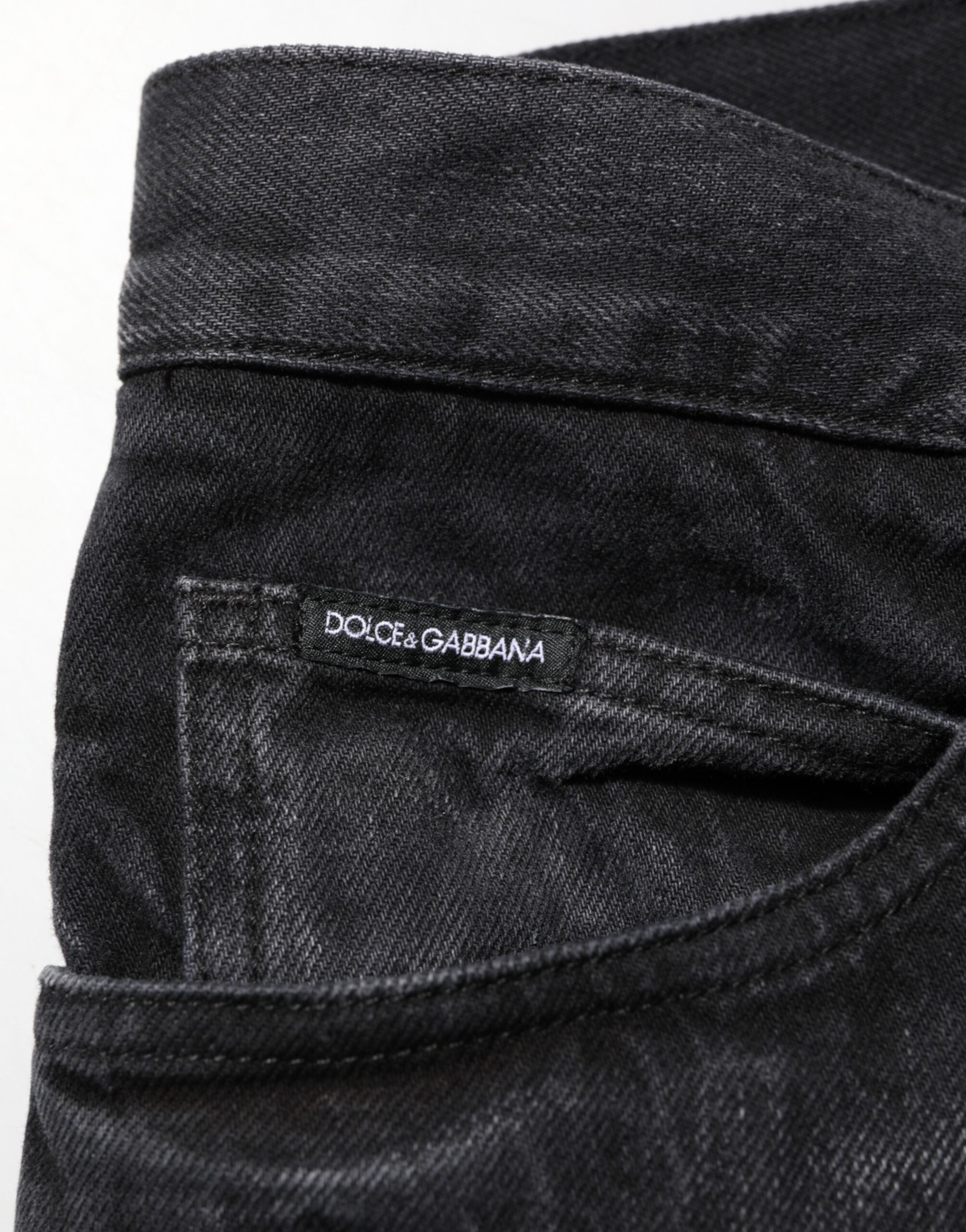 Jeans skinny en denim noir en coton délavé de Dolce & Gabbana pour homme, coupe ajustée et style moderne.