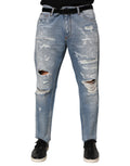 Jeans en denim déchiré bleu Dolce & Gabbana, pantalons distressed avec déchirures fashion pour homme.