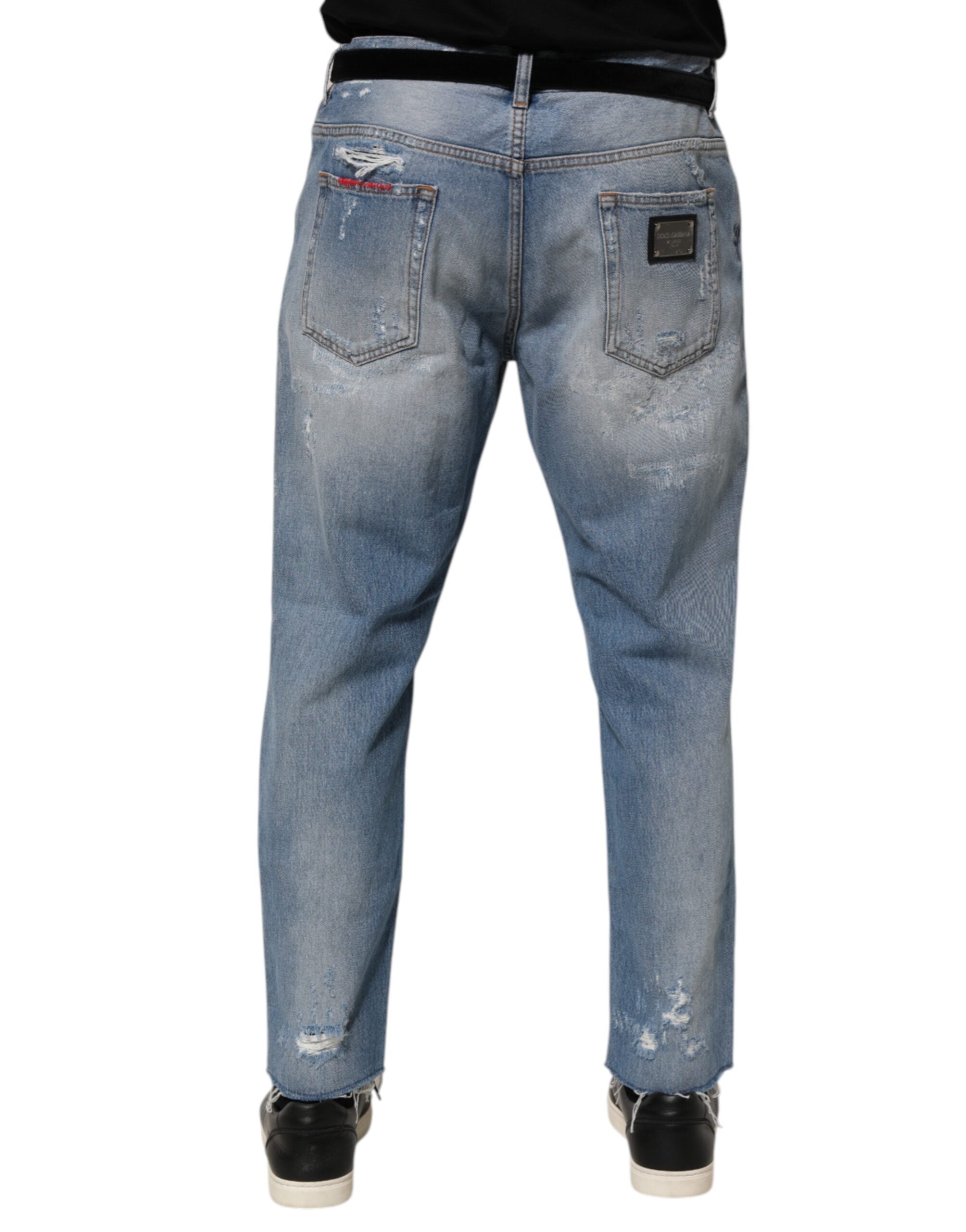 Pantalons en jeans déchirés et usés Dolce & Gabbana bleu, coupe décontractée avec détails distressed.