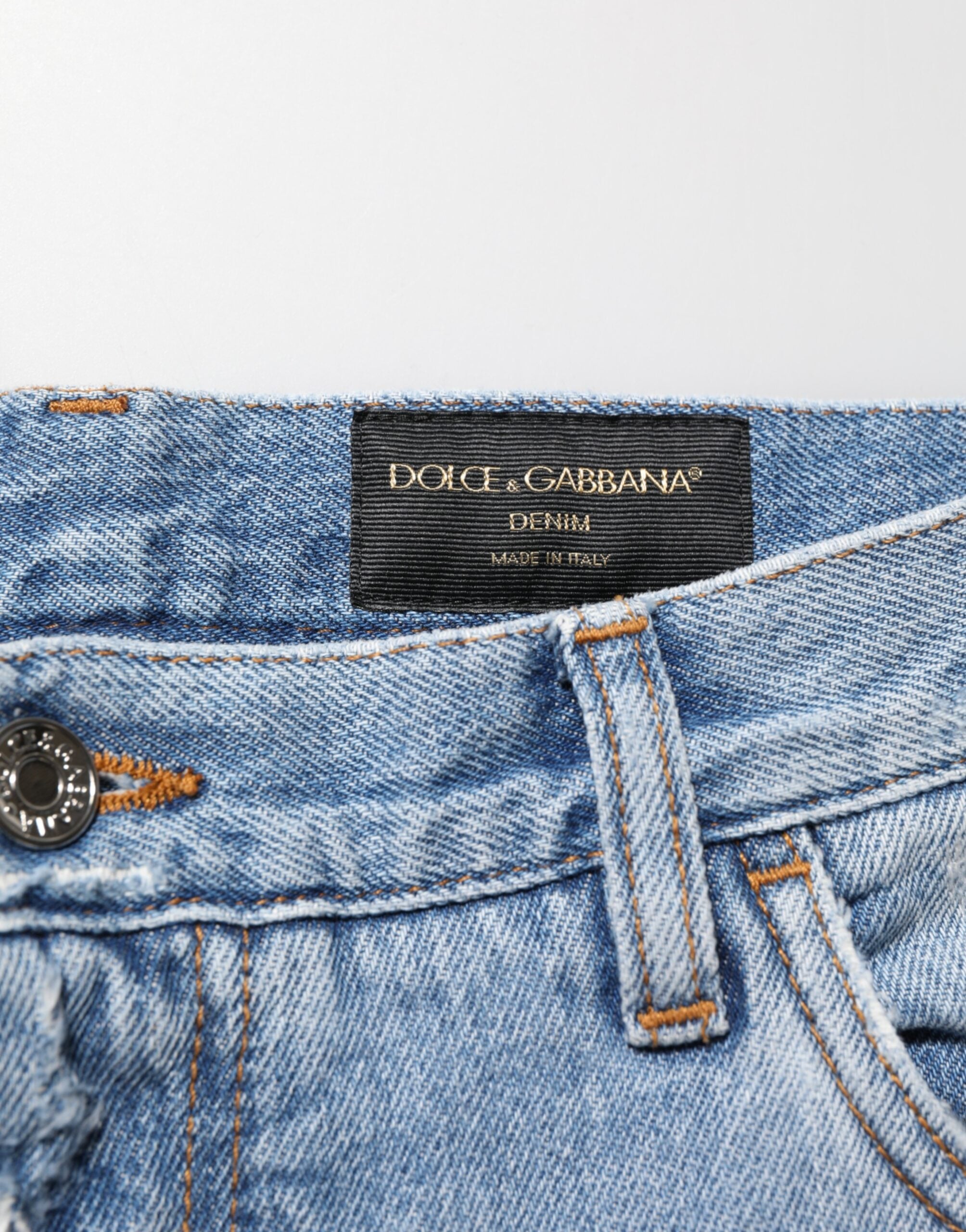 Pantalon en jean bleu déchiré et usé de Dolce & Gabbana, style décontracté avec détails déchirés et finition délavée.