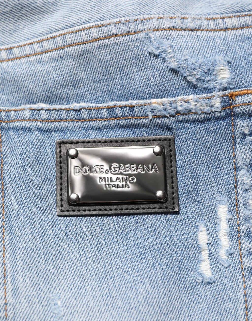 Pantalons en jean déchiré bleu Dolce & Gabbana avec effet usé et déchirures, style décontracté et tendance.