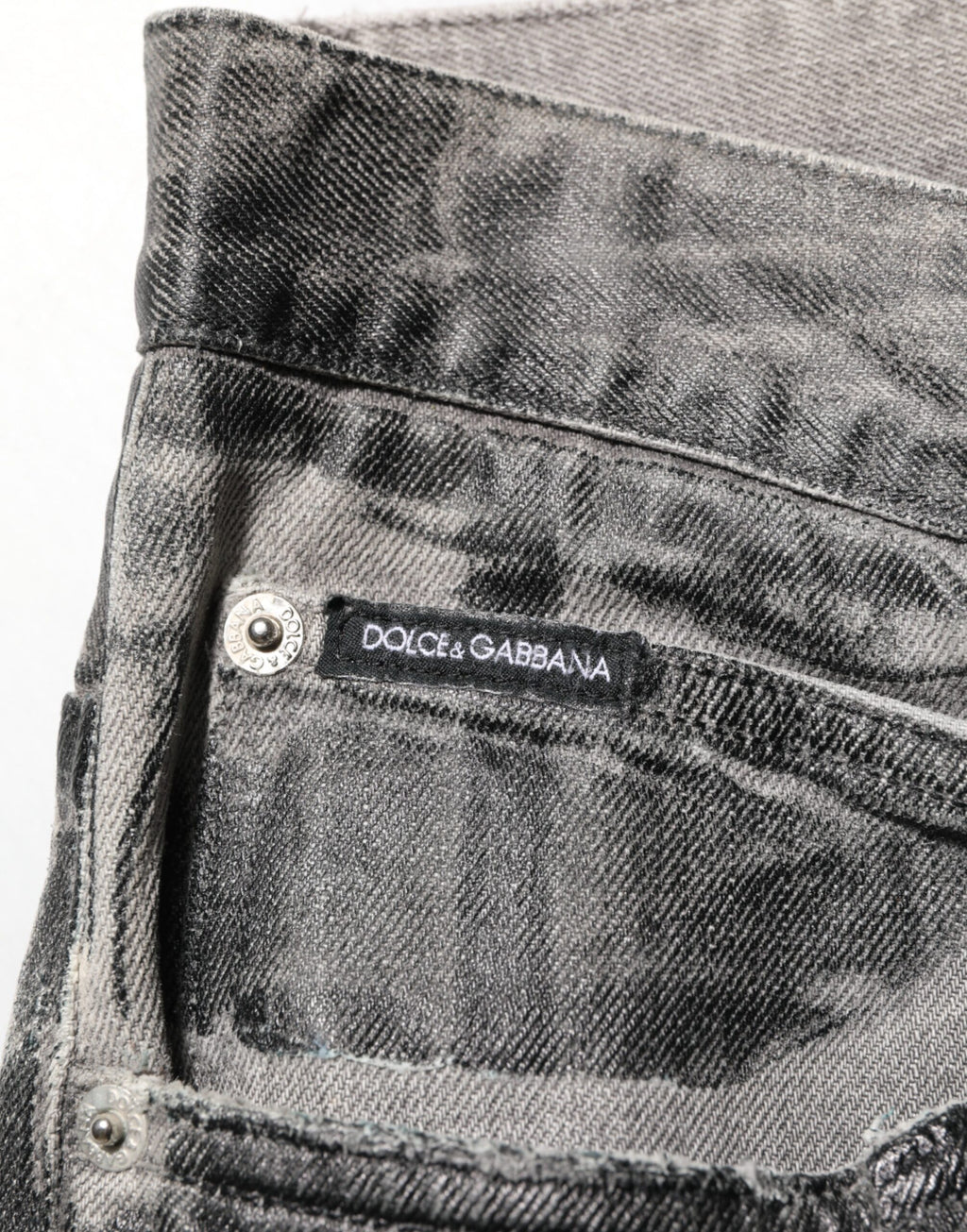 Pantalons en jean Dolce & Gabbana noir et gris à motif graphique, denim avec détails modernes et style tendance.