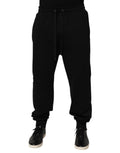 Pantalon de survêtement noir en coton Dolce & Gabbana avec cordon de serrage et logo sur la jambe.