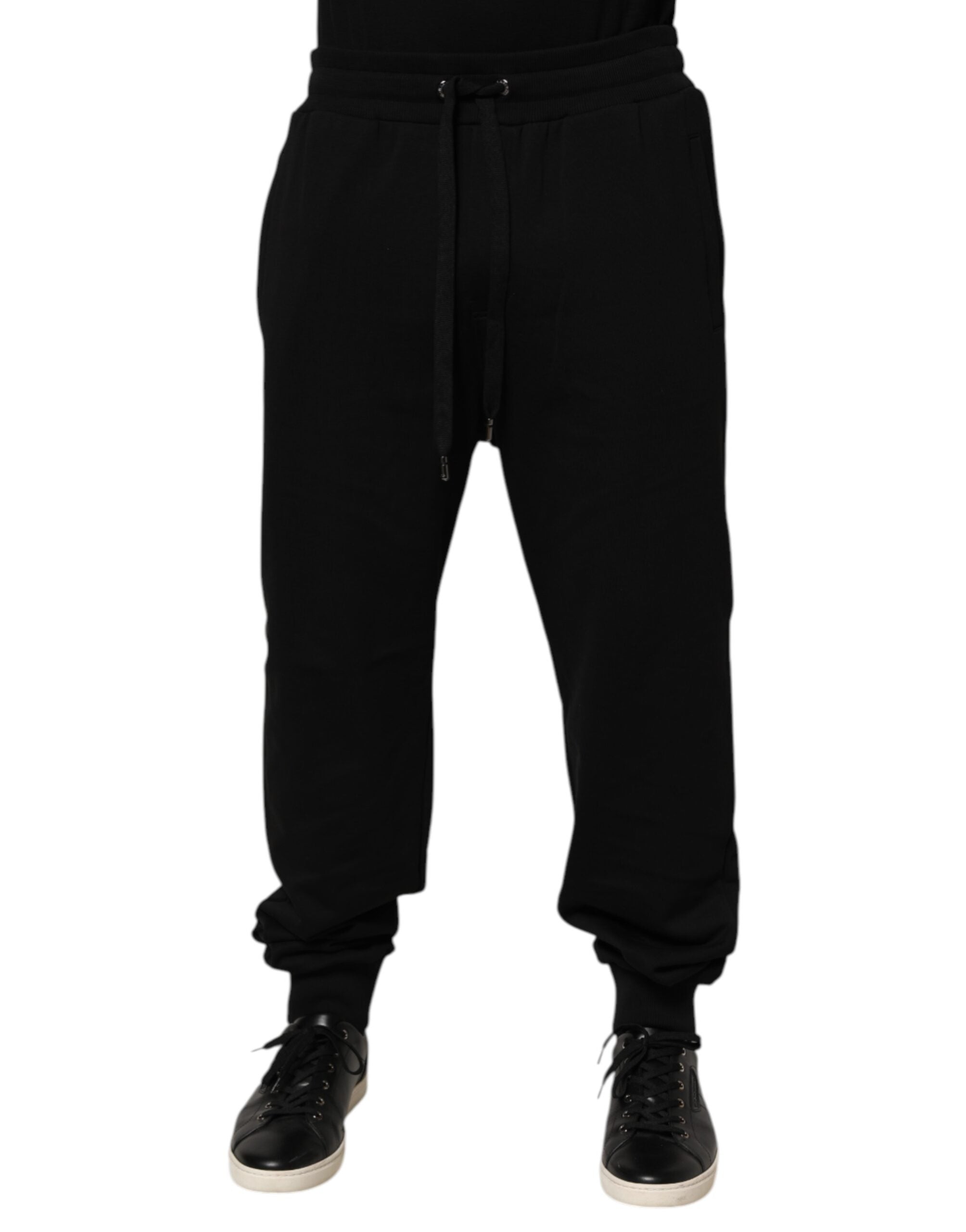 Pantalon de jogging noir Dolce & Gabbana en coton avec cordon de serrage et logo visible sur la jambe.