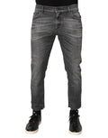 Jeans slim en denim gris Dolce & Gabbana en coton, avec détails déchirés et style décontracté.