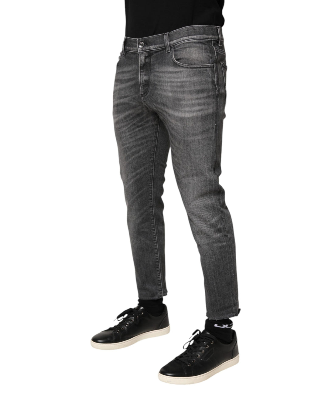 Pantalons en denim gris slim fit Dolce & Gabbana en coton avec déchirures et détails usés, vue de face.