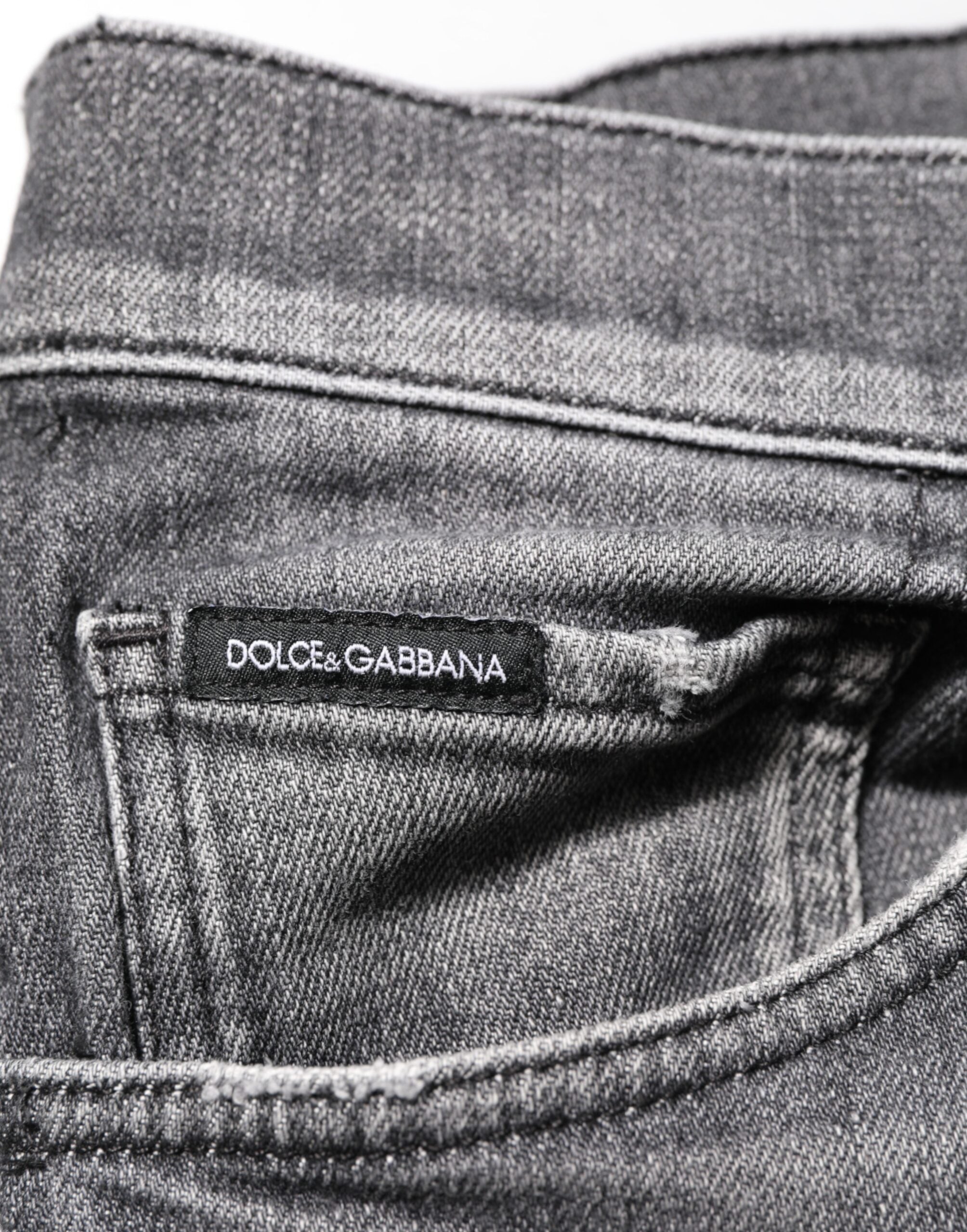 Pantalons slim en denim gris en coton de Dolce & Gabbana, style décontracté avec détails déchirés, vue du devant.